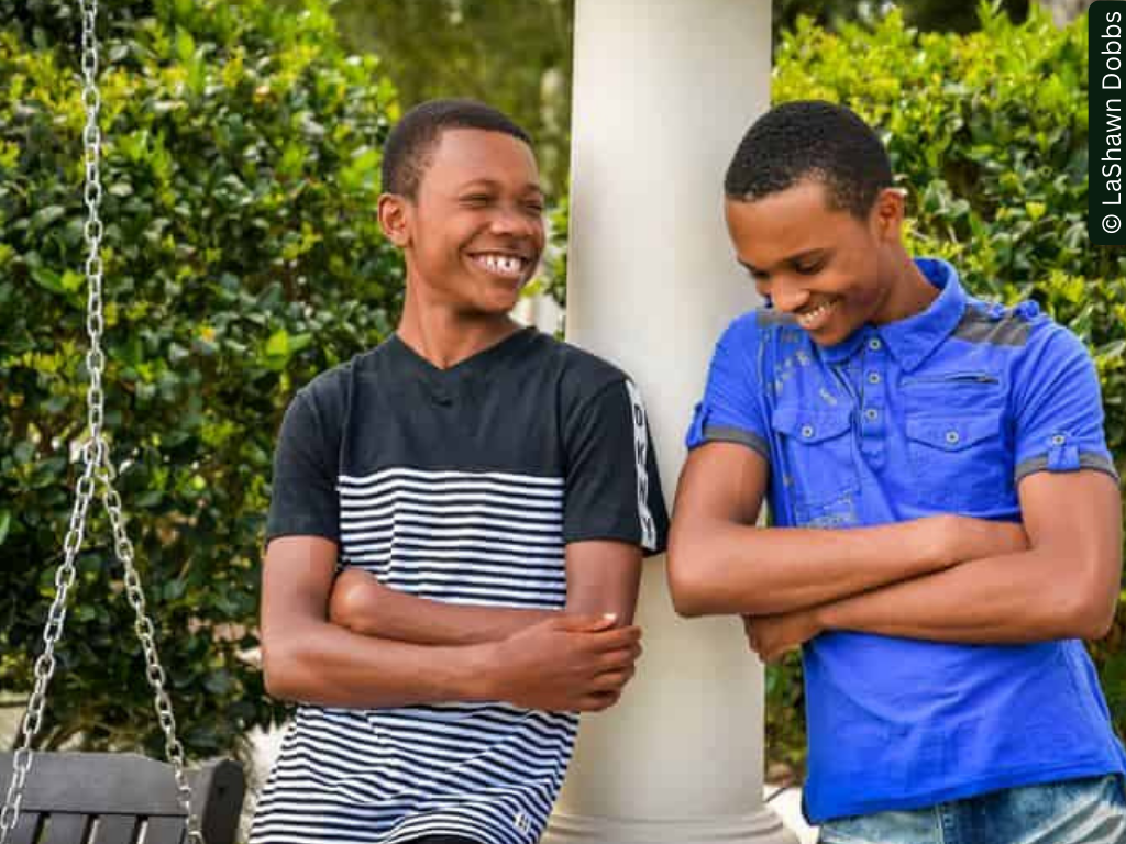 two black boys chat and laugh