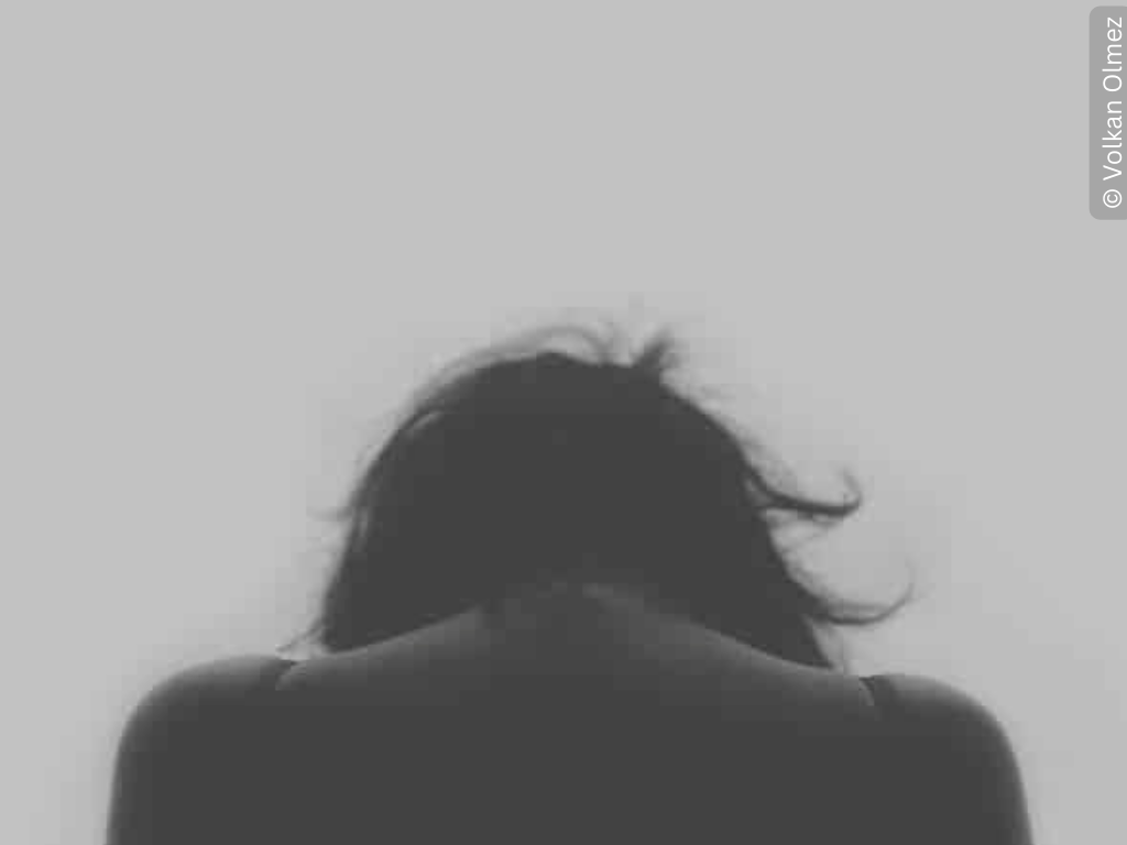 a hunched figure